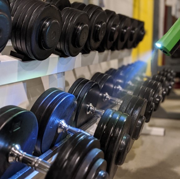 cleaner disinfecting gym weights in hobart gym